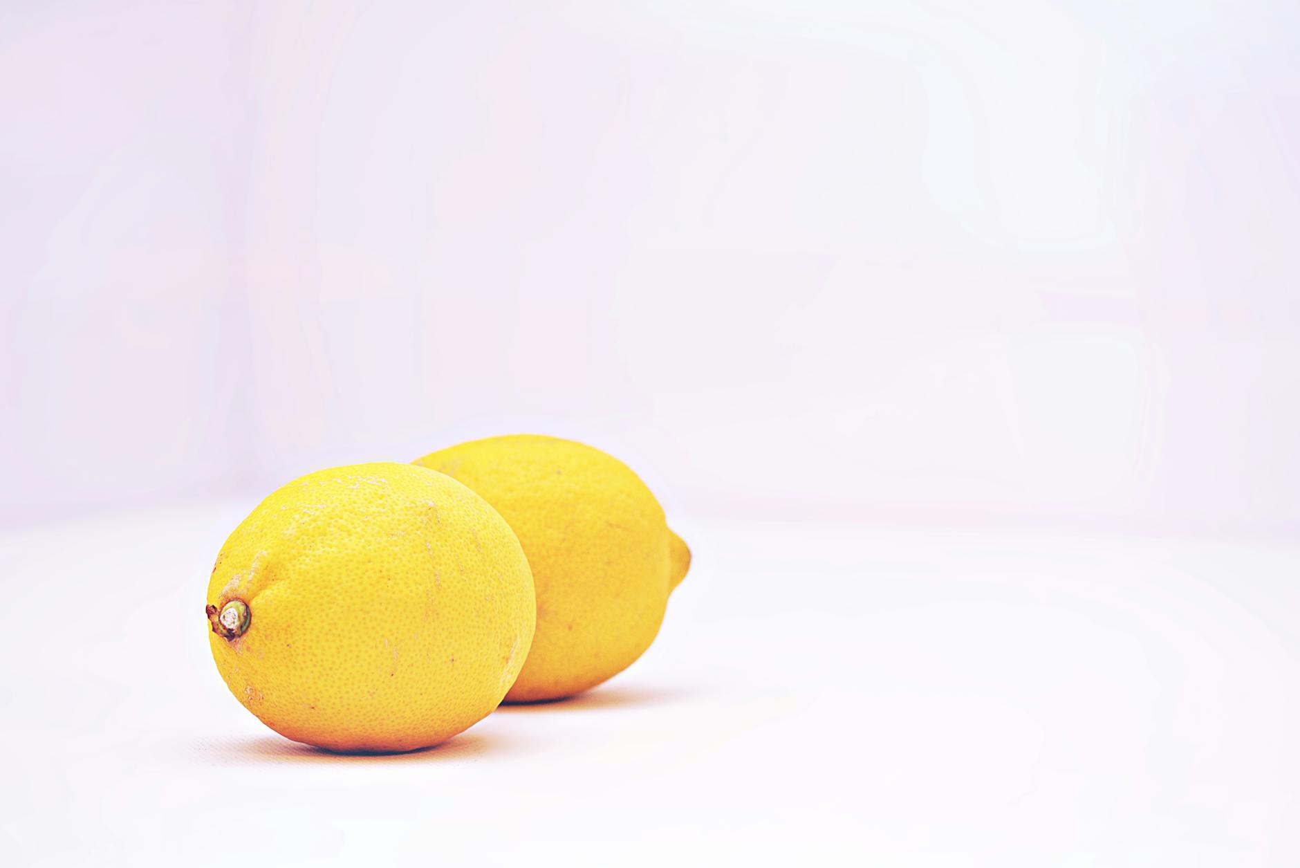 Fresh lemons on a white background, symbolizing renewal and citrus vitality