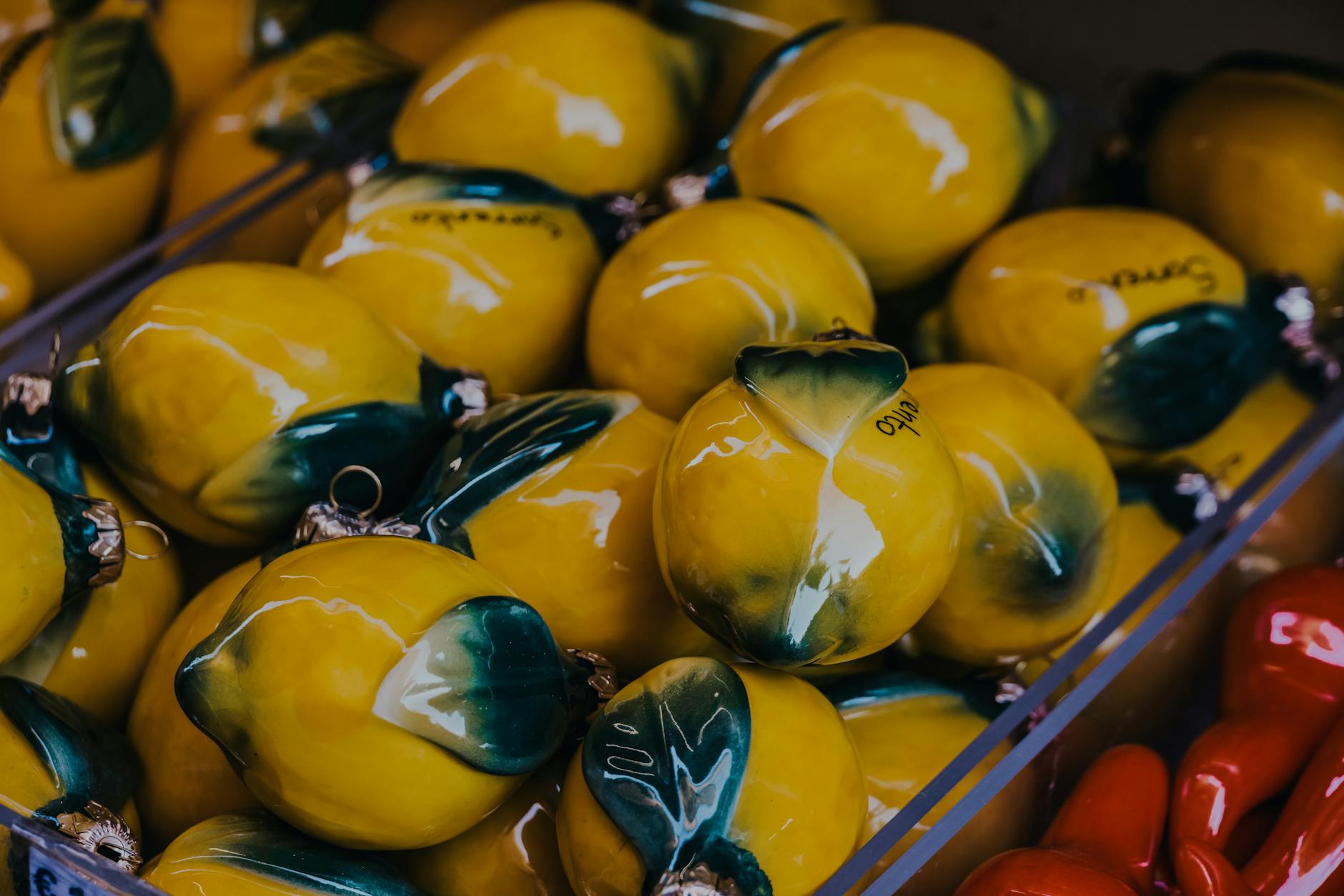 Vibrant lemon-shaped objects artfully arranged, symbolizing the design philosophy behind modern clitoral vibrators.